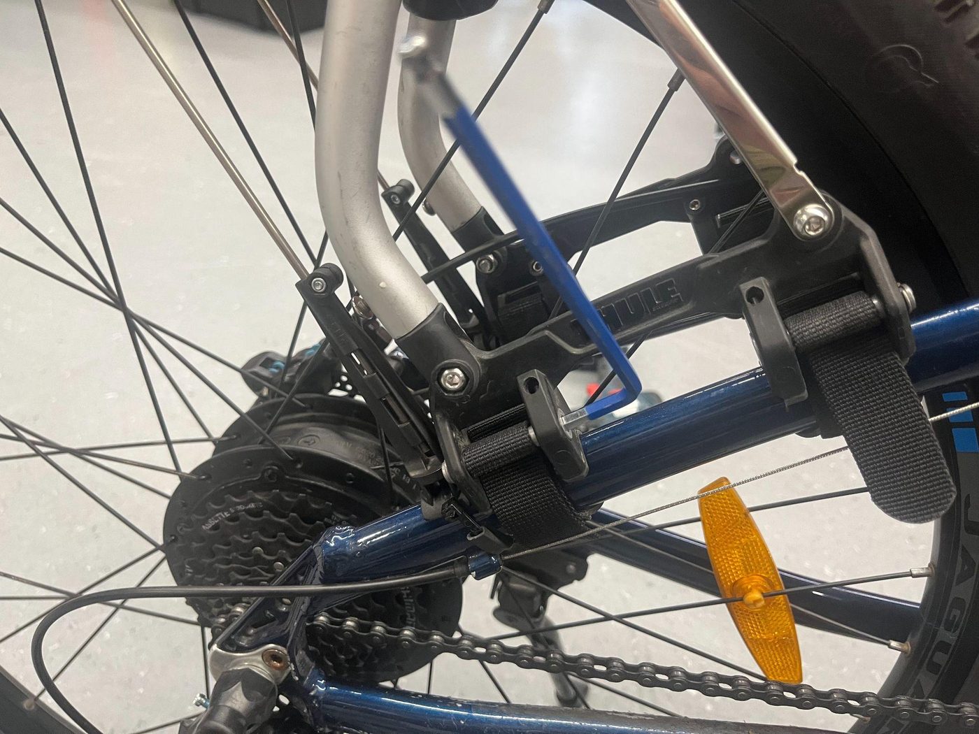 Threading the strap back through the mechanism's slot