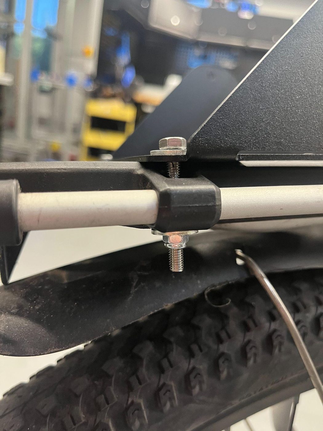 Tightening the mount bolts with two wrenches