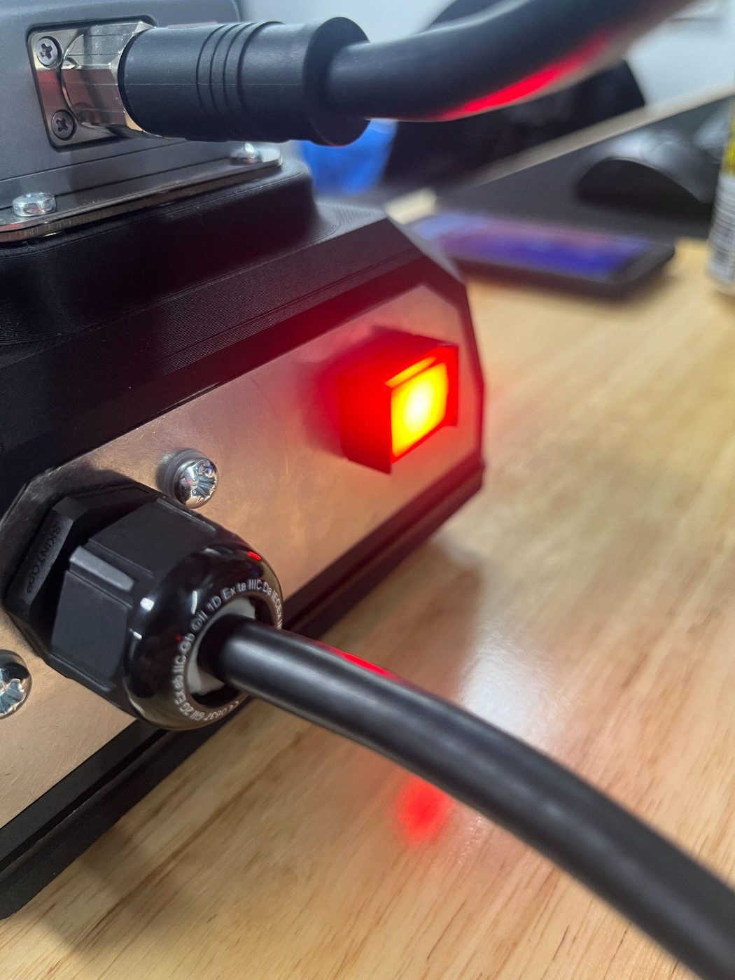 The box's red power/record button glowing