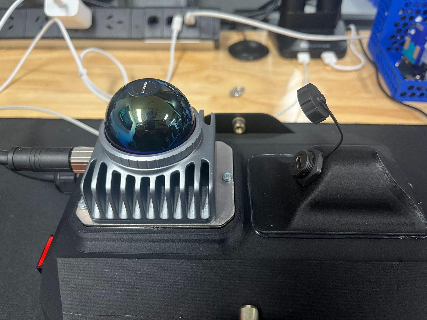 Unscrewing the cap to reveal the USB-C charging port